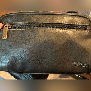Kenneth Cole Reaction- black leather toiletry bag. Clean inside.